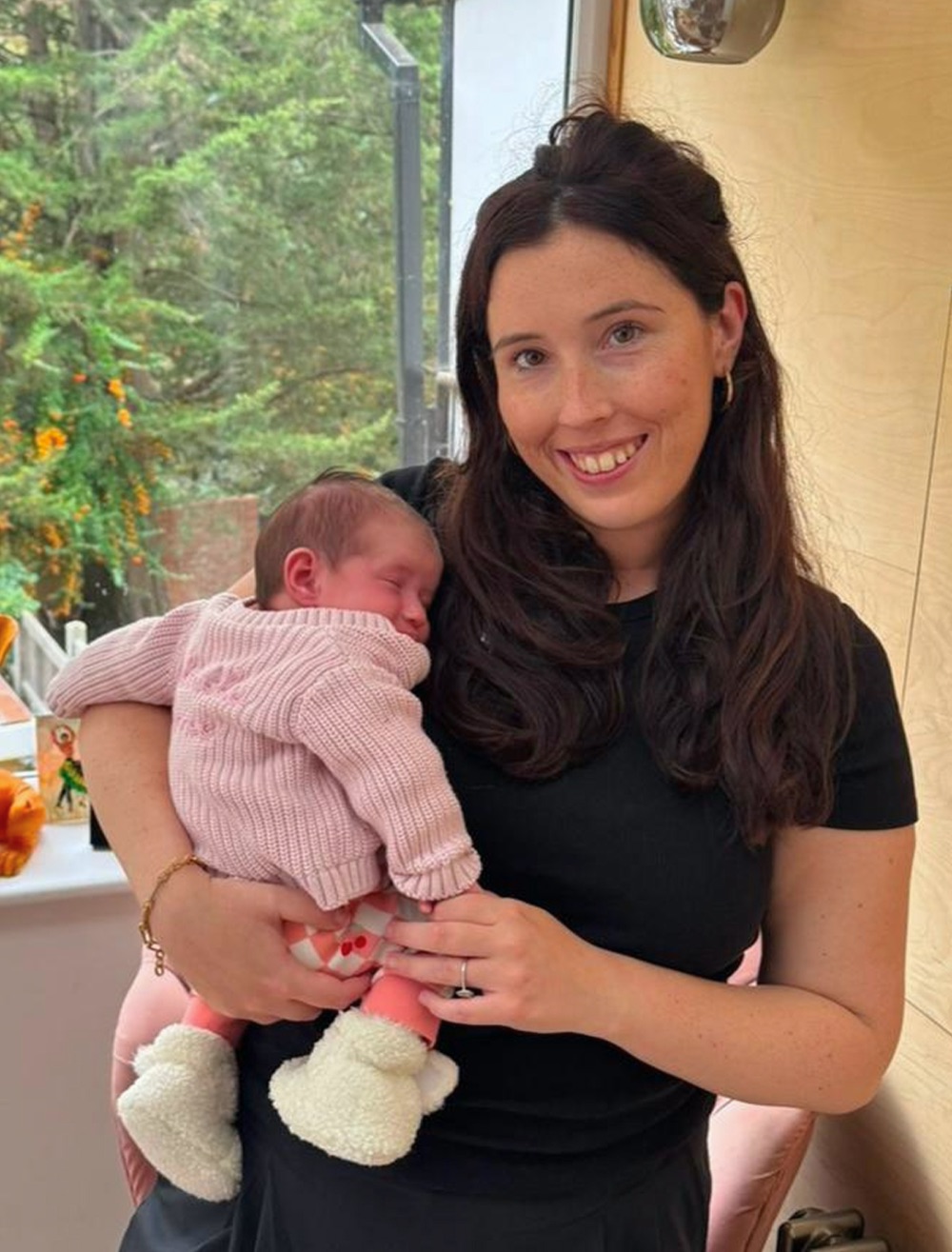 Leanne, founder of Fourth Trimester Club, holding her baby daughter Goldie